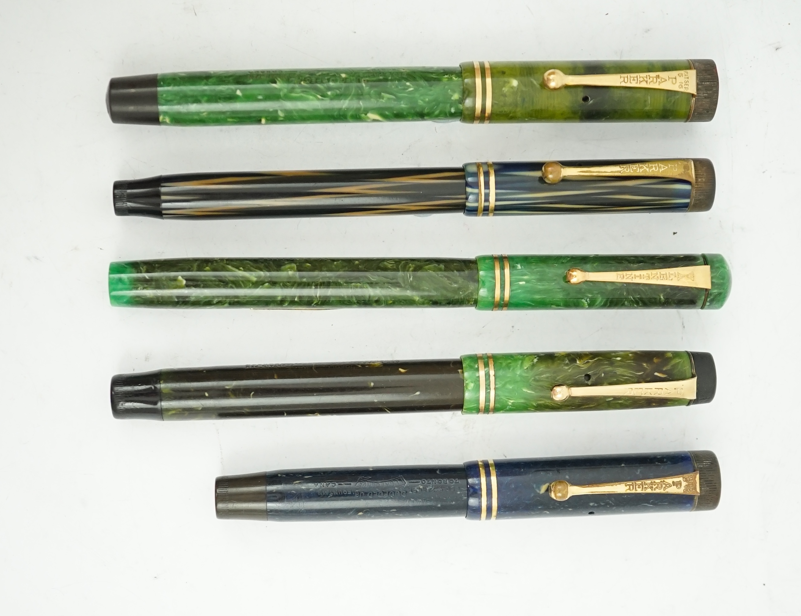 Four Parker Duofold pens and a Valentine fountain pen